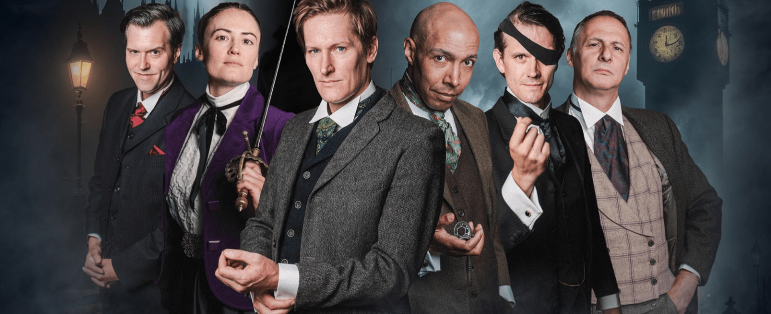 A man in a black coat and tophat looks away next to Big Ben and a stream train