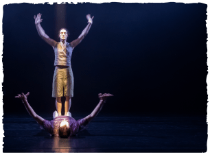 dancer with arms raised