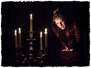 A woman by candlight