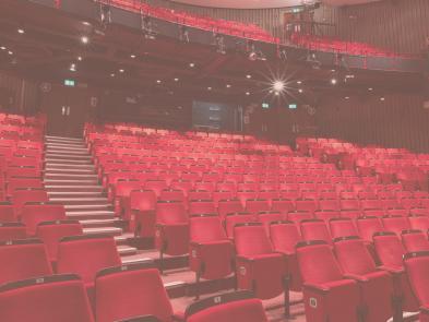 Image of red auditorium seats.