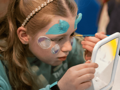 Young girl with blue special effects make up on