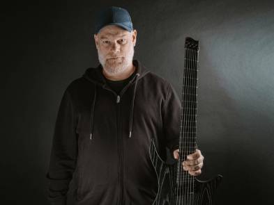 A man holding a guitar