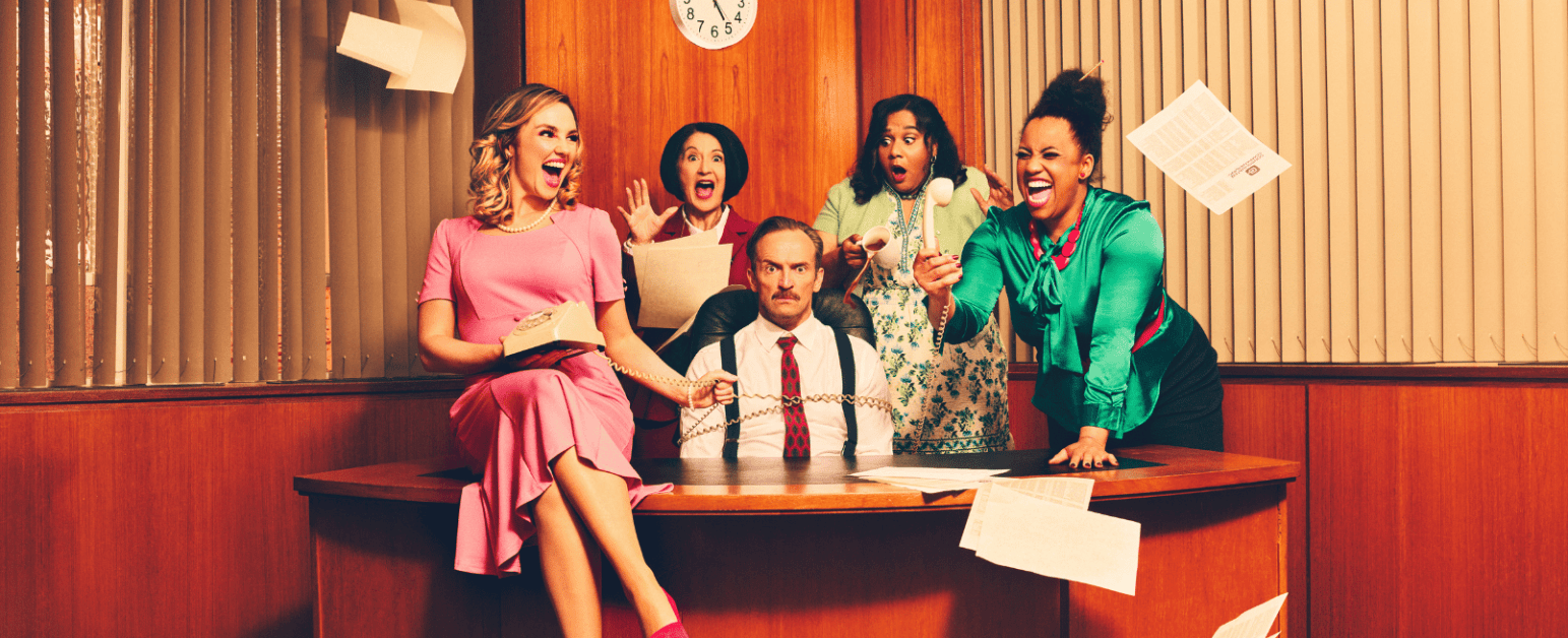 9 to 5 cast around a desk