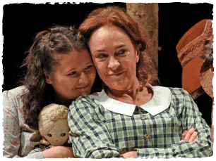 2 females hugging. Daughter embracing mother from behind.