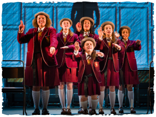 Girls in school uniform in a choir formation