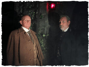 2 men with serious facial expressions