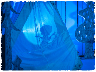 A vikign shadow puppet in blue light