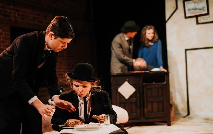 Youth Theatre members performing on stage.
