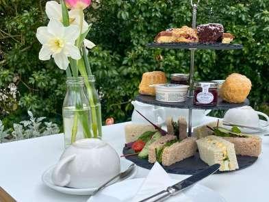 An Afternoon tea selection with finger sandwiches, cakes and scones