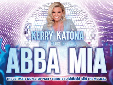 KERRY KATONA IN ASPARKLY DRESS AGAINST A BLUE BACKGROUND WITH A DISCO BALL