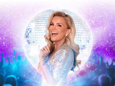 KERRY KATONA IN ASPARKLY DRESS AGAINST A BLUE BACKGROUND WITH A DISCO BALL
